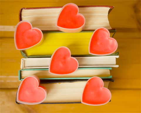 stack of books with hearts
