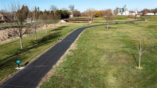 Image of Turtle Creek Park walking path with installed StoryWalk book stands