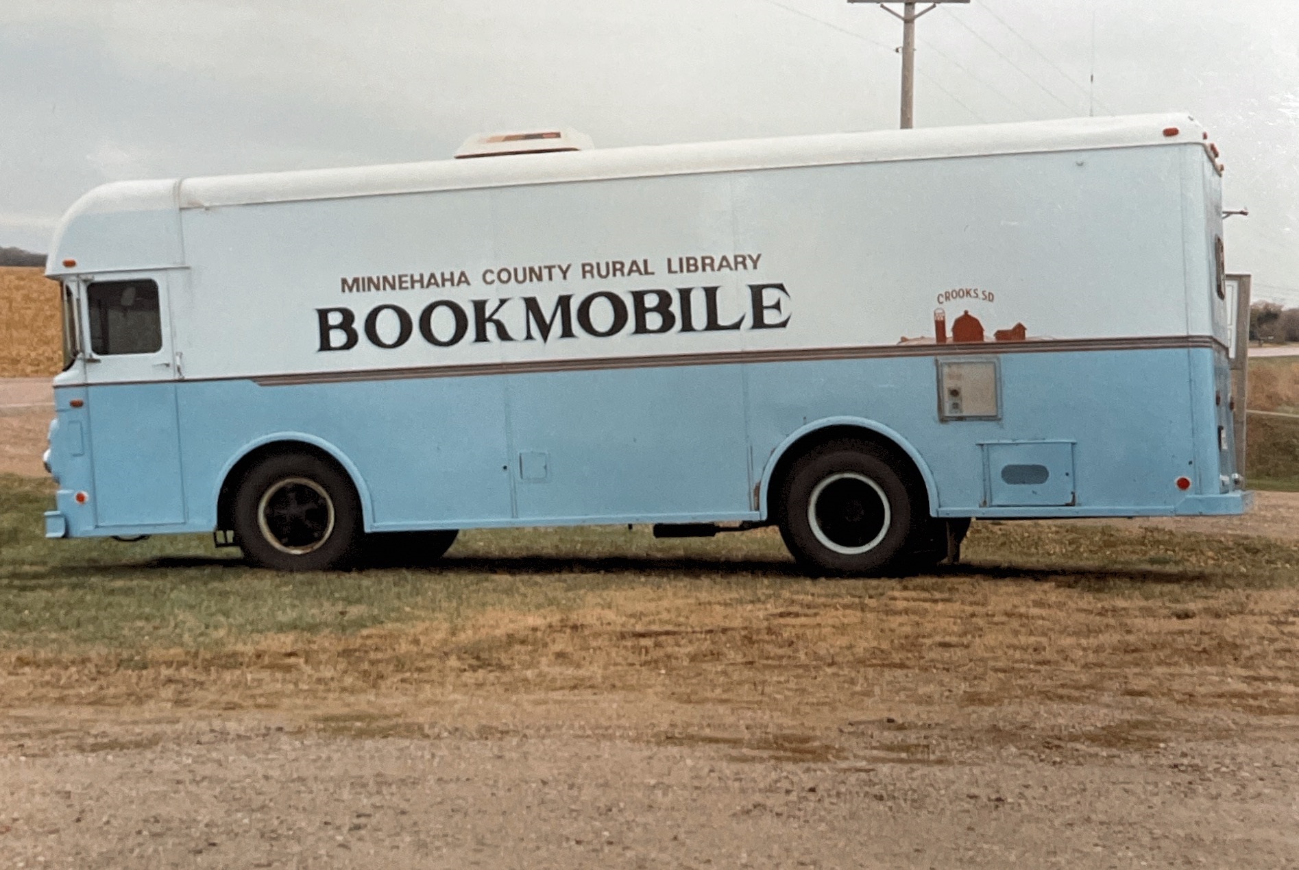 Large bus-like vehicle labeled, Minnehaha County Rural Library Bookmobile