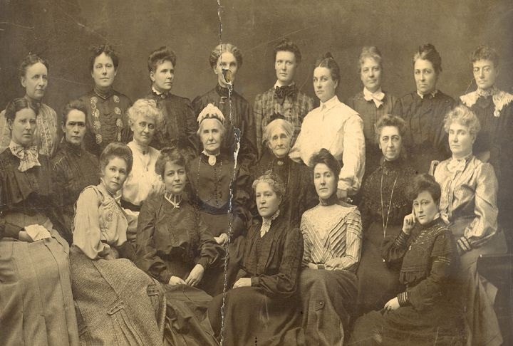 Twenty one women in the Ladies History Club pose for a group picture