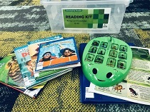 Reading kit unpacked to show included book titles and interactive bug activity.